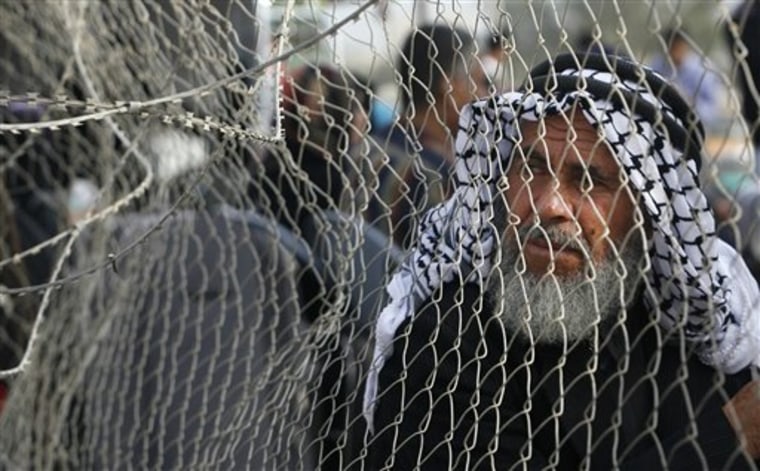 A Palestinian man waits before crossing into Egypt through the Rafah border crossing, southern Gaza Strip, Thursday, May 26, 2011. 
